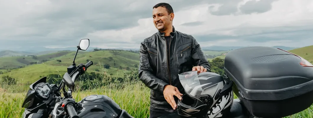 Motorcyclist enjoying the countryside view. How to File Motorcycle Insurance Claims.