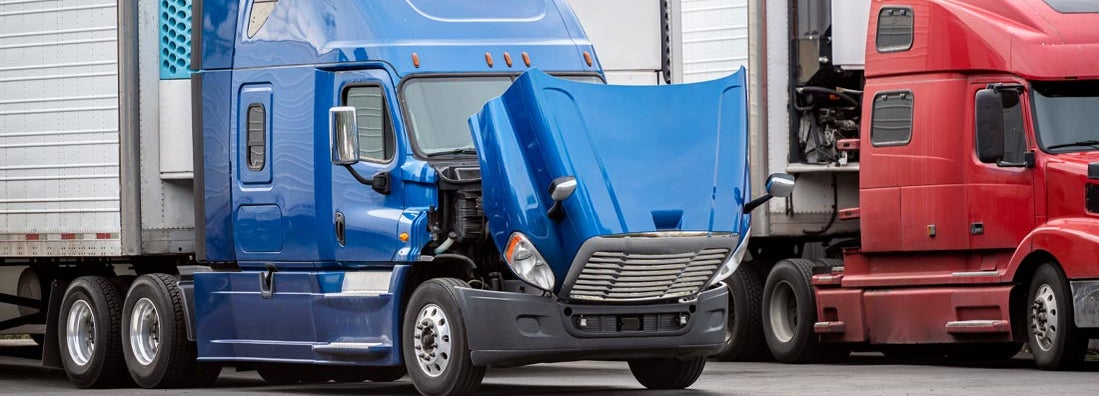 Big rig blue semi truck with open hood waiting for engine inspection and maintenance. Find fleet repair service insurance.