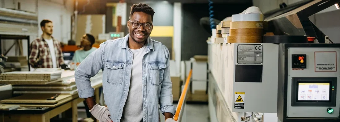 Professional carpenter posing in workshop while working late. How to Find the Best Business Insurance in Camas, Washington.