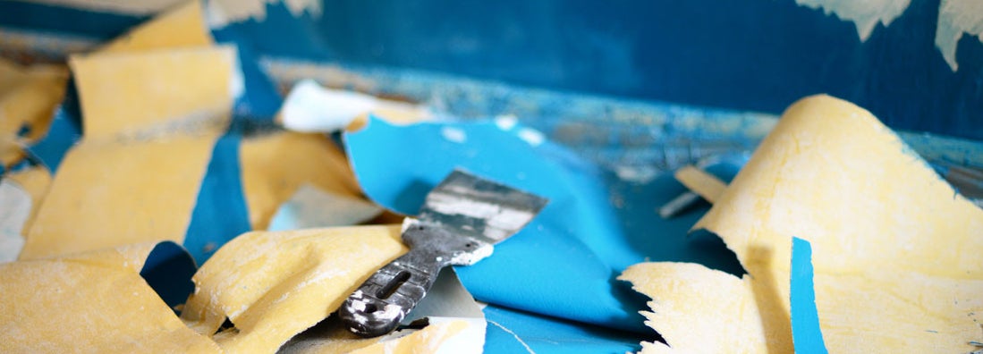 Removing wallpaper in house. Find paint and wallpaper stripping insurance.