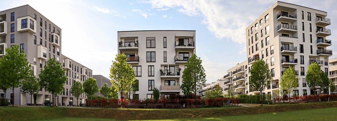 Cityscape with modern apartment buildings, new green urban landscape in the city. Find Wisconsin renters insurance.