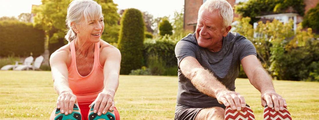 Healthy Senior Couple Exercising Together. Best Life Insurance Companies for Seniors in 2022.