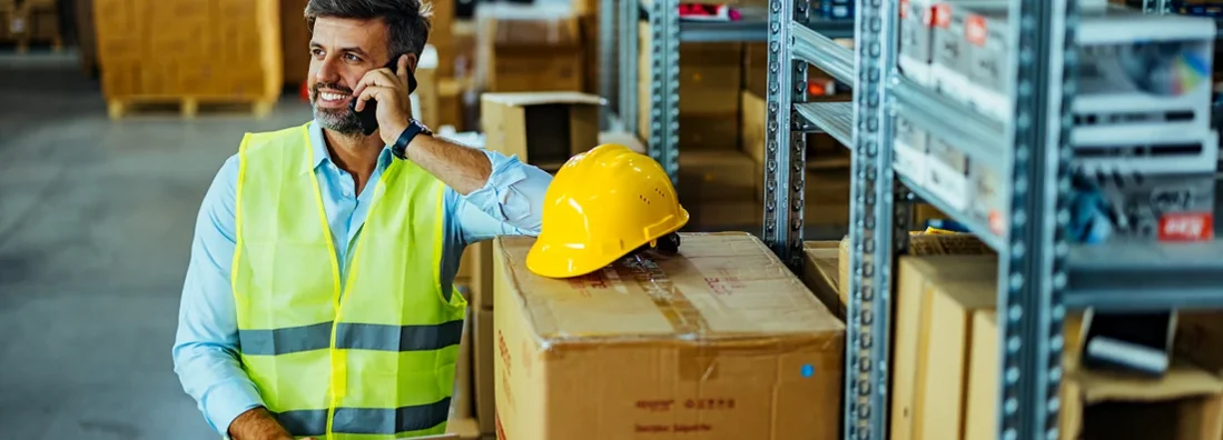 Engineer using a smartphone in an industrial place of work. How to Find the Best Business Insurance in Mount Lebanon, Pennsylvania.