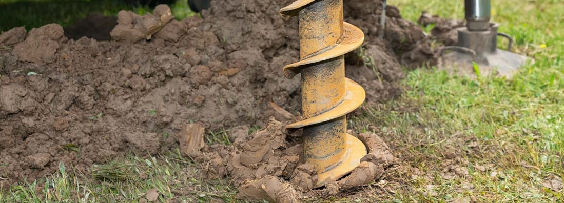 Earth Auger drilling fence post hole. Find post hole digging service insurance.