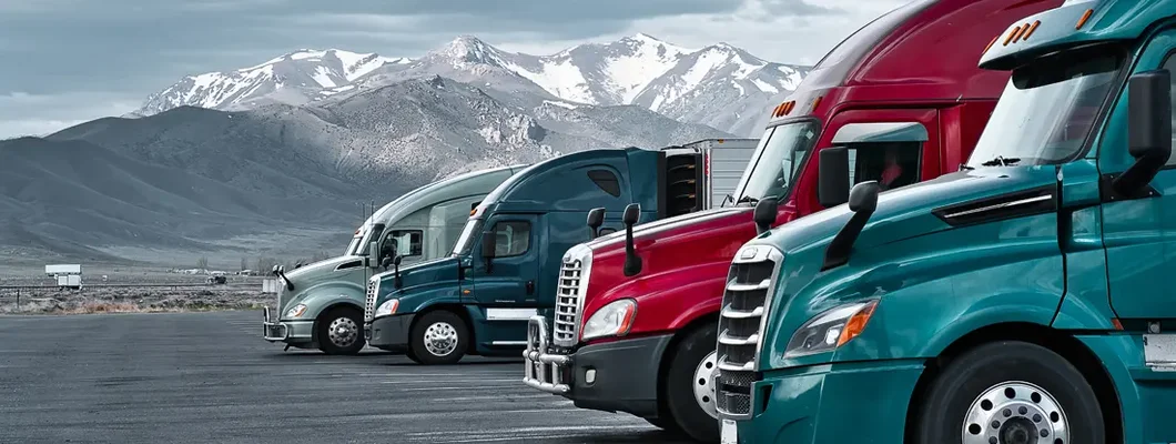 Commercial trucks at a truck stop in Nevada. Best Trucking Insurance Companies of 2022.