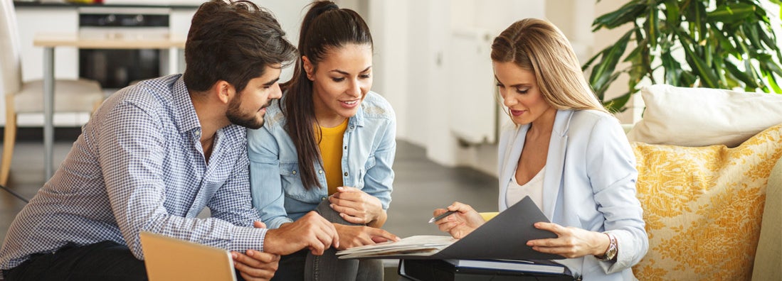 Real Estate agent with a young couple