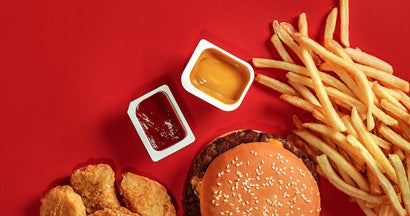 Fast food on red background.  How to insure a fast food restaurant. 
