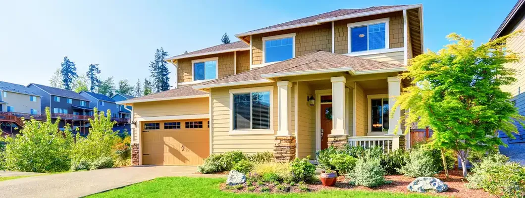 Beautiful curb appeal of luxury beige house. Narragansett, Rhode Island Homeowners Insurance. 