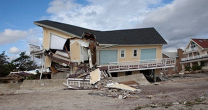 Damaged home after Hurricane Sandy. Find hurricane aftermath insurance.