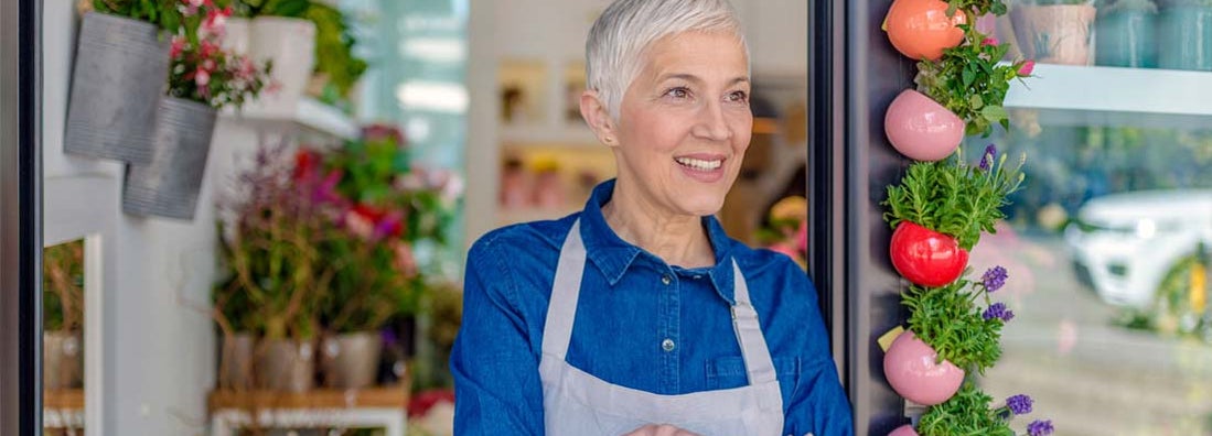 small business owner looking out window