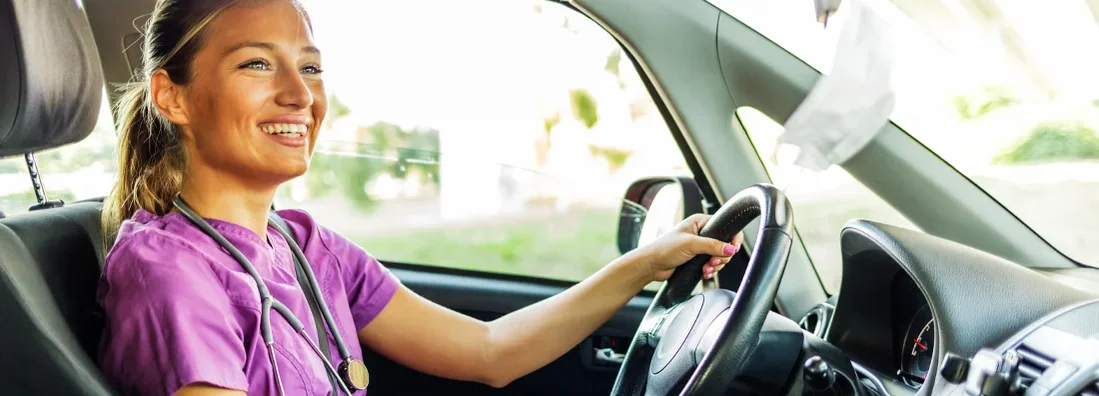 Nurse driving home after a day's work. How to Find the Best Car Insurance in Jericho, New York.