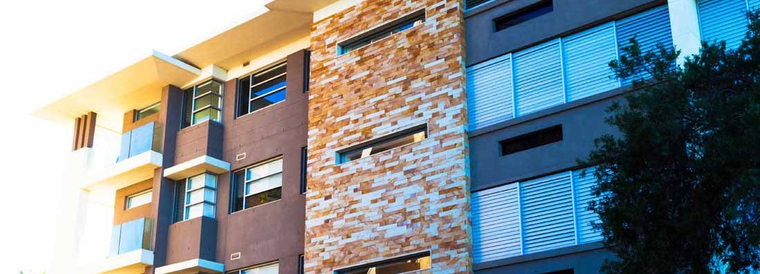 Modern apartment building in dusk sunlight