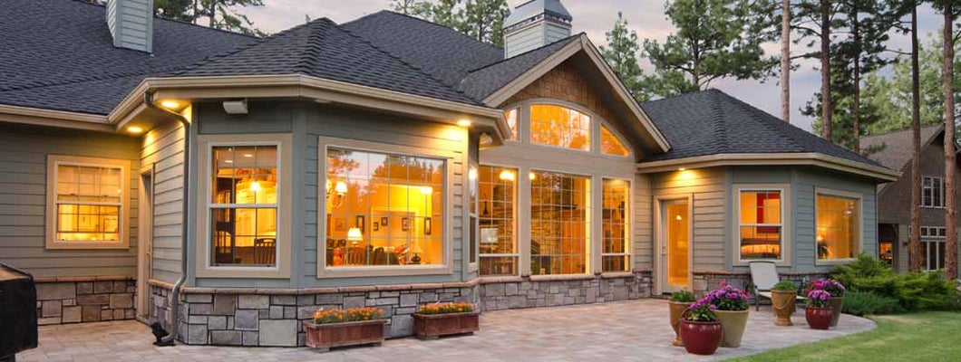Twilight exterior of home and landscape