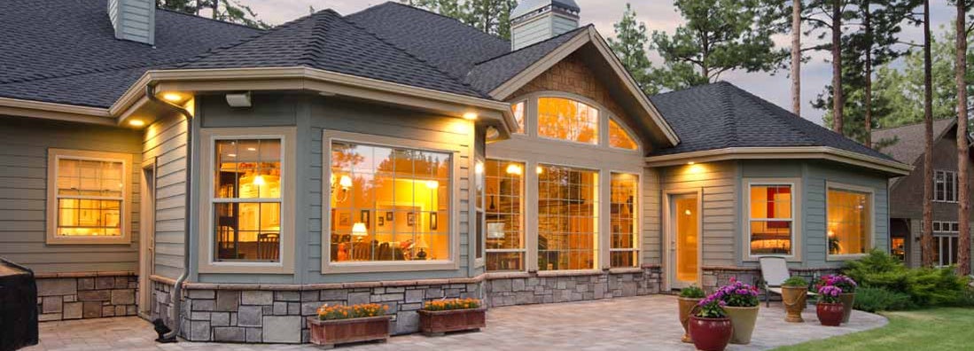 Twilight exterior of home and landscape