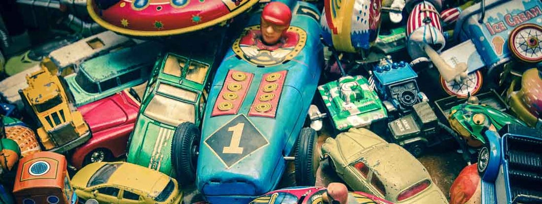 Vintage toys on a wooden floor. Find Antique and Collectibles Insurance.