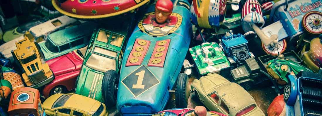 Vintage toys on a wooden floor. Find Antique and Collectibles Insurance.