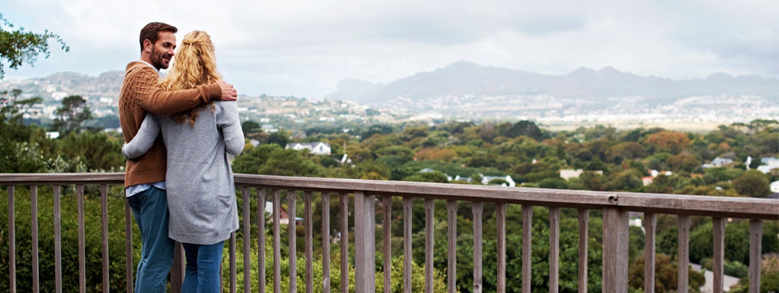 Couple standing on a balcony