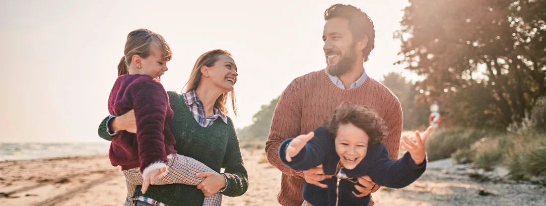Family on the beach. Life Insurance Claims.