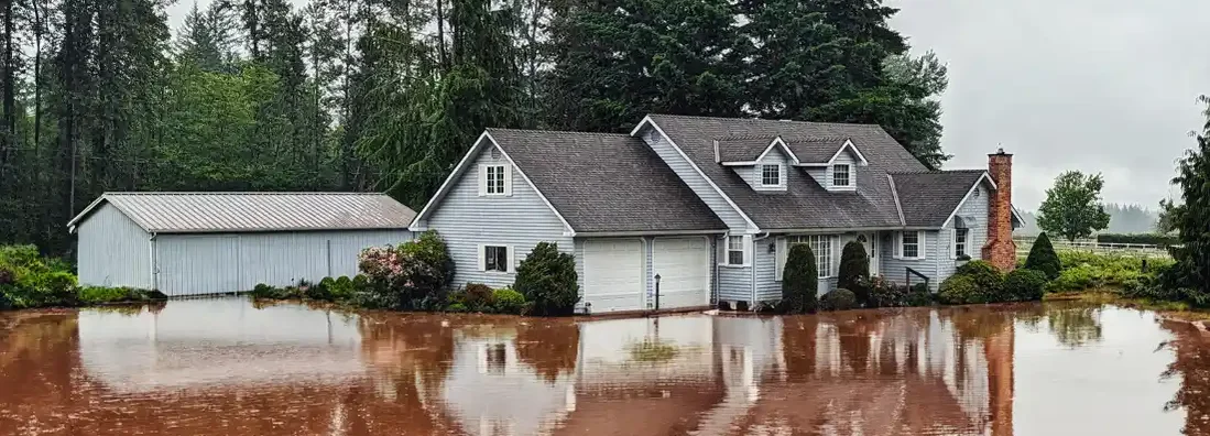 House exterior with flooded yard. Find South Carolina Flood Insurance.