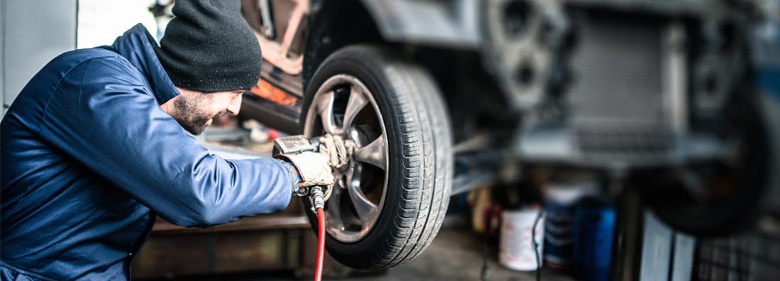 mechanic changing the tire