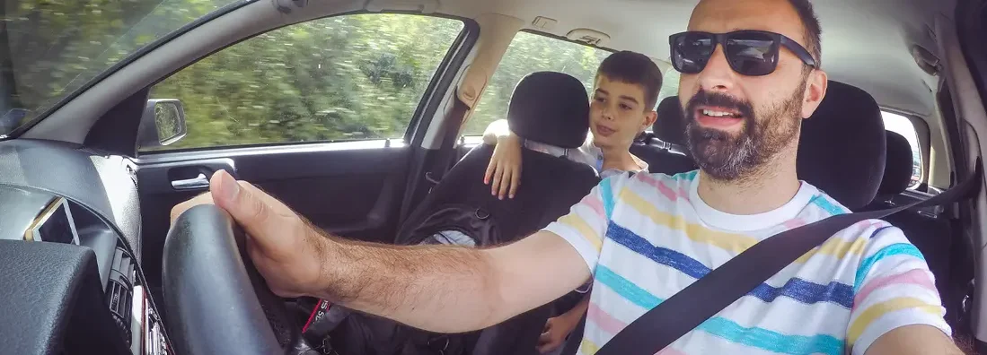 Family traveling in car. Find Jenks, Oklahoma car insurance.