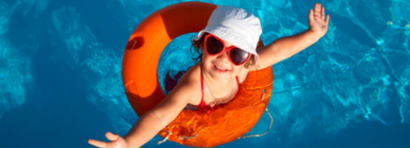 Girl swims in pool at new house.