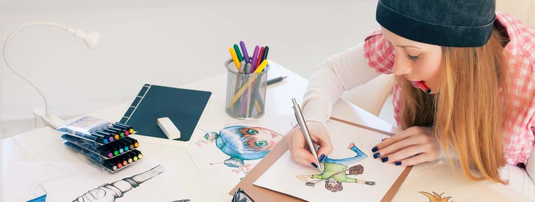 Young female artist painting in art studio.