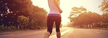 Woman running at sunset