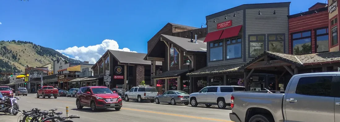 Street with old houses, bicycles and cars. Jackson, Wyoming Car Insurance.