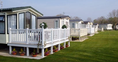 Mobile homes in a park. Find Mobile Home Insurance.