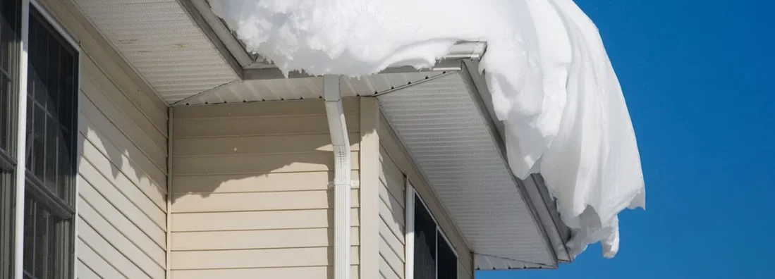 Thick pile of snow on the rooftop of a house. How Much Snow Is Too Much on an Illinois Home’s Roof?