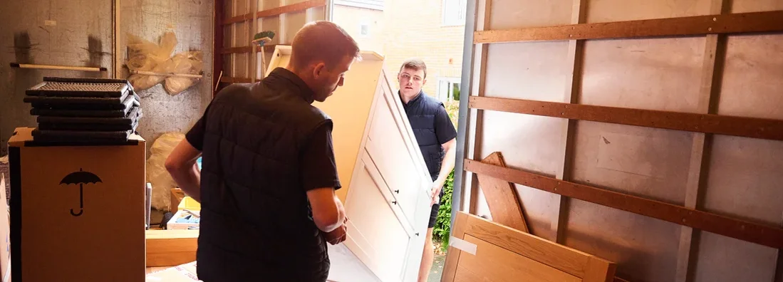 Men loading furniture into removal truck. Find Moving Insurance.