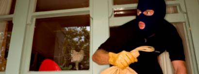 Burglar leaving home through window