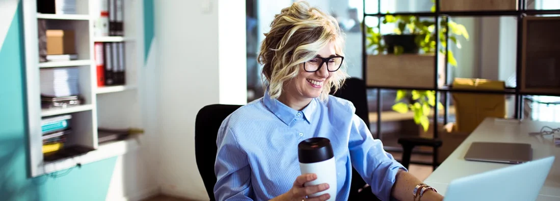 Female office worker working on a project. How to Find the Best Business Insurance in Augusta, Maine.