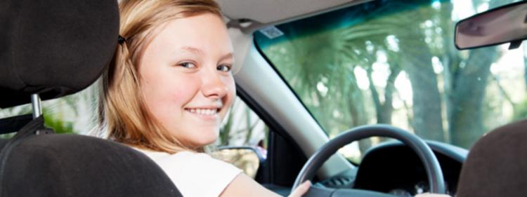 A young girl with a school driving permit