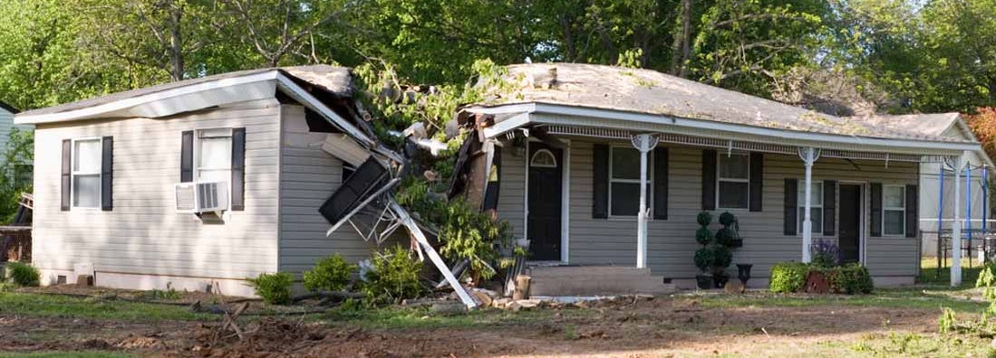 A damaged home after a large tree fell on it during a tornado. How long until you get paid on a Home Insurance Claim?