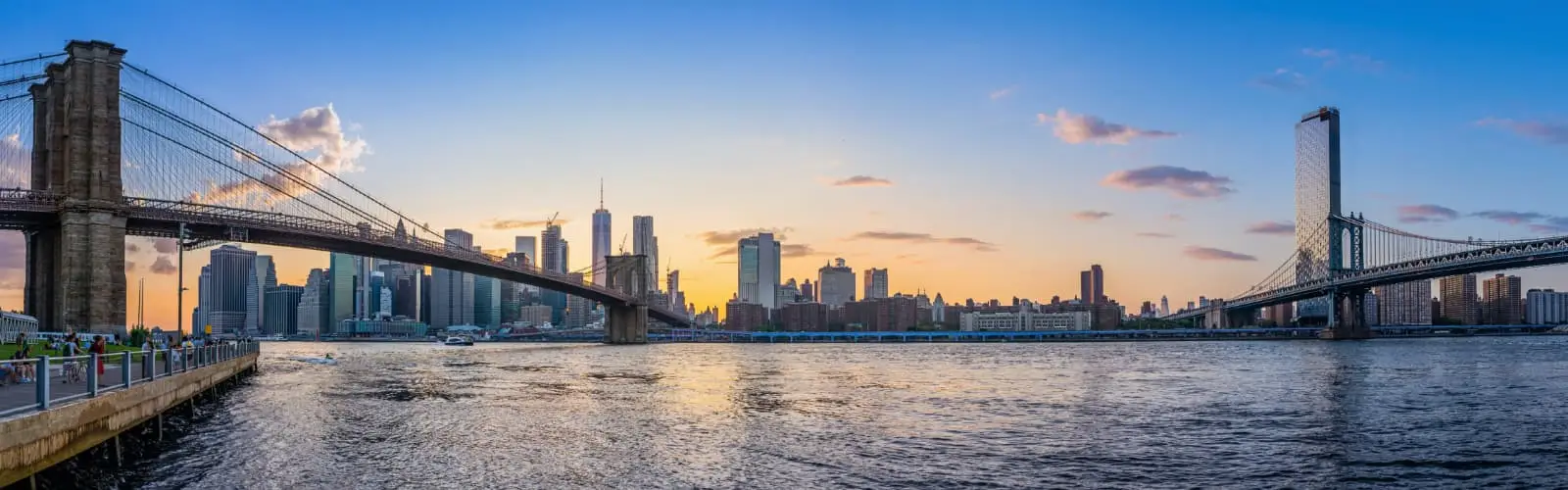 Panoramic view at lower manhattan while sunset. Find New York Insurance.