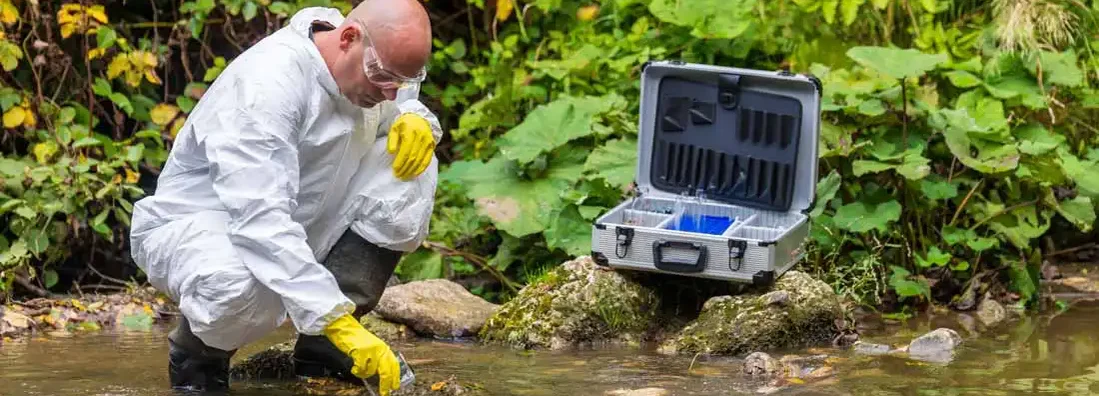 Scientist examing toxic water. Find Environmental Consulting Insurance.