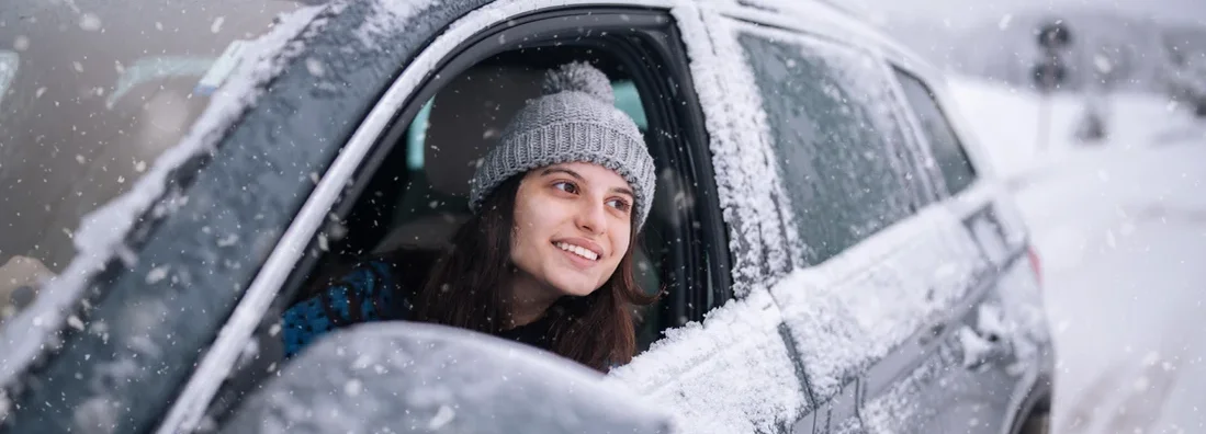 Young woman on a winter journey. The 5 Best All-Wheel Drive and Four-Wheel Drive Cars.