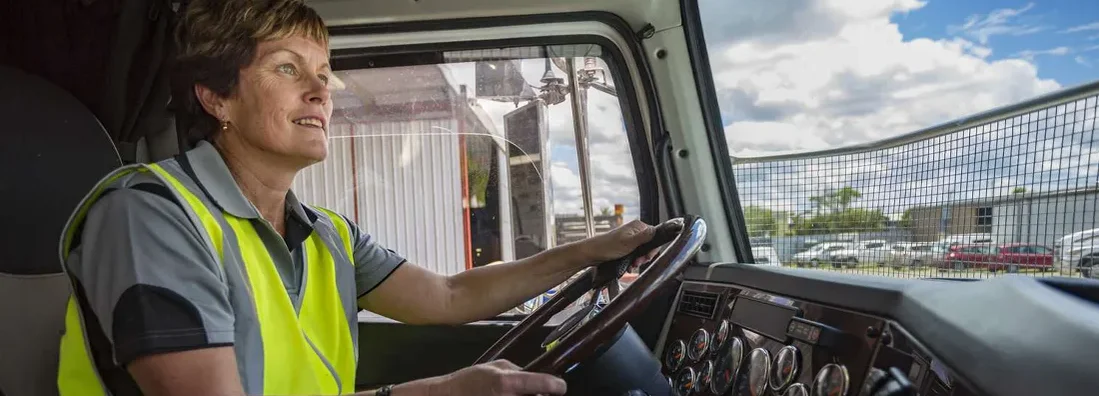 Woman Driving a Company Truck. Find North Dakota Commercial Vehicle Insurance. 