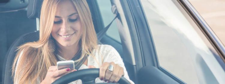 teenage girl texting while driving