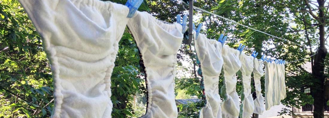 Cloth Diapers on drying on line. Find diaper supply services.