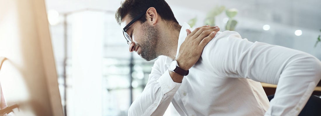 Man with an injured shoulder. Average workers compensation shoulder injury.