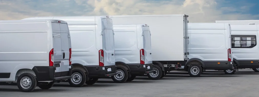 Minibuses in the parking lot at the bus stop. Find Commercial Vehicle Insurance Cost.