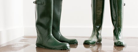 Couple in boots on flooded floor