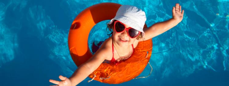 Girl swims in pool at new house.