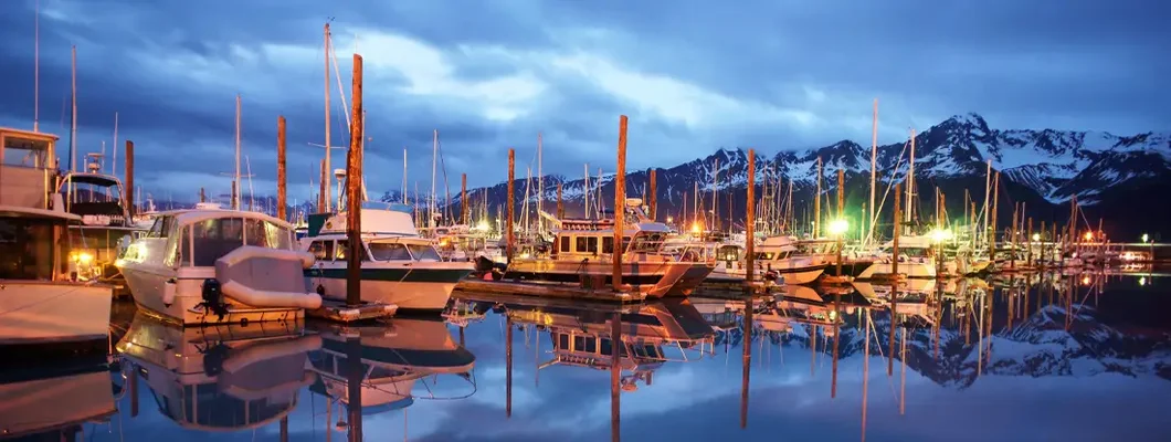 Boats on Smooth Resurrection Bay Seward Alaska Harbor Marina. Find Alaska Boat Insurance.