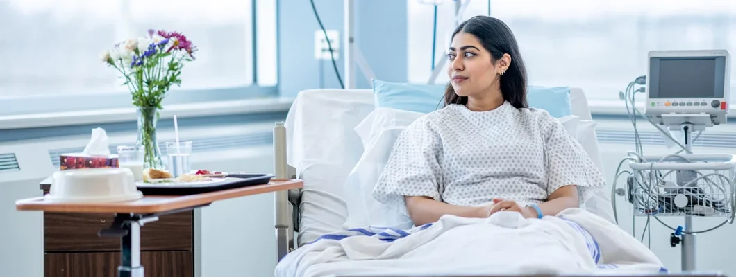 Woman in the Hospital. Find Hospital Insurance.