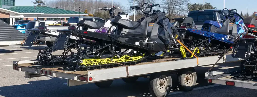 Trailer with snowmobile. How to Transport Your Snowmobile Legally.