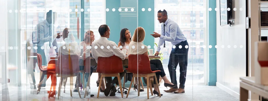 Professional business meeting occurring within a modern office. Florida Directors and Officers Insurance.